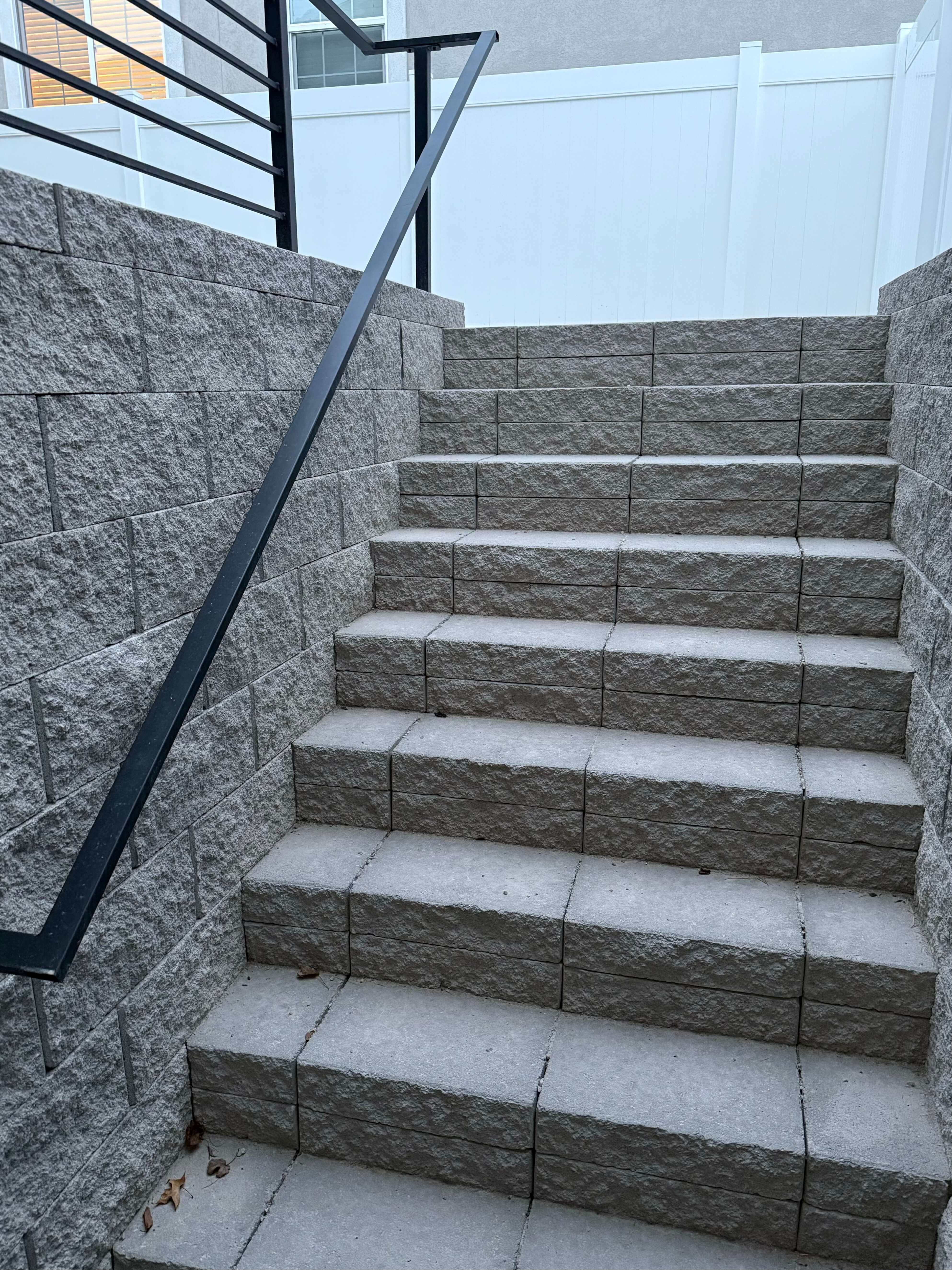 Custom outdoor space design with hardscapes and landscape features